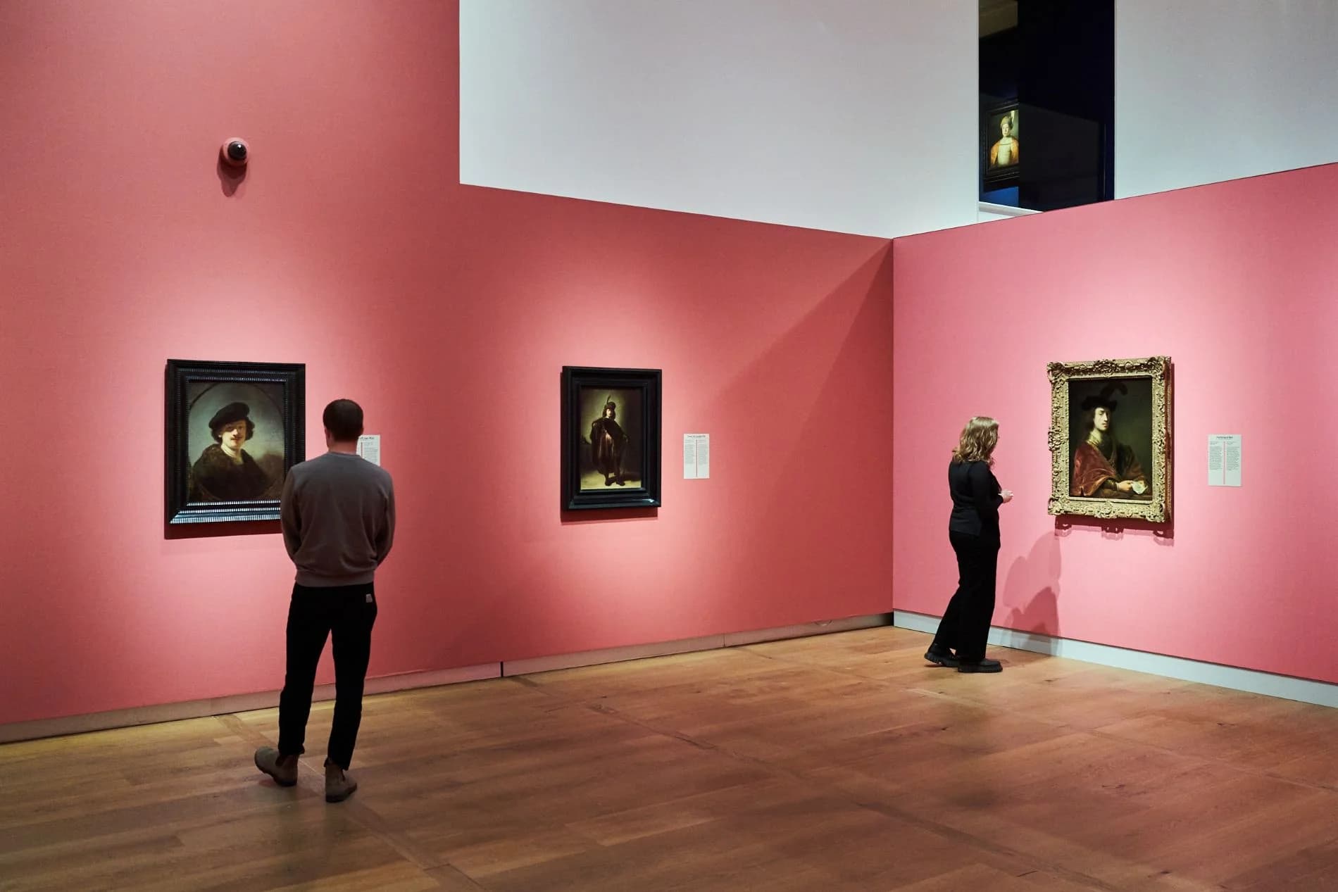 Installation view of From Rembrandt to Vermeer at the H'ART Museum, Amsterdam, with Leiden Collection portraits on pink walls