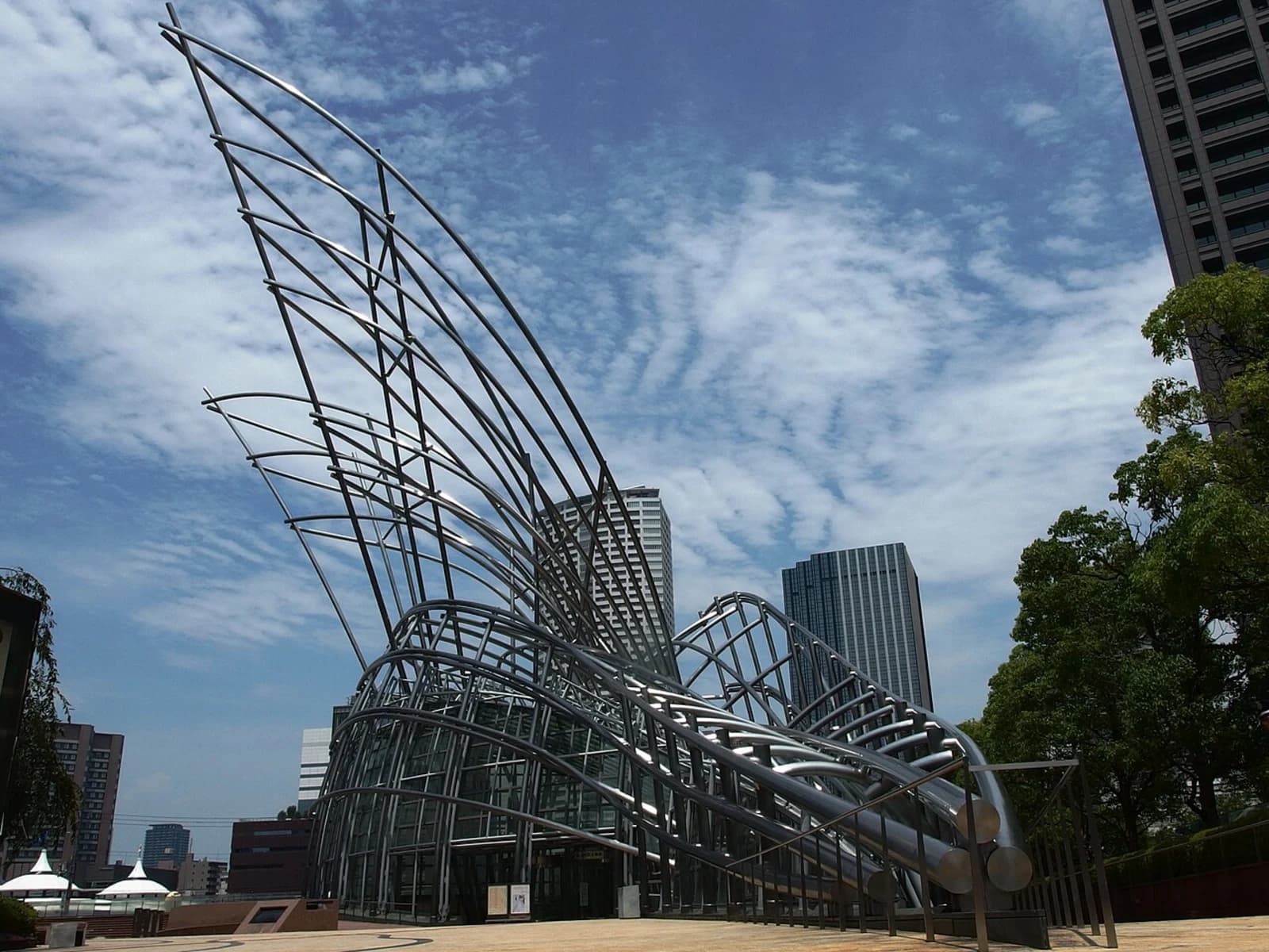 Exterior of The National Museum of Art, Osaka, showing the distinctive steel sculpture above the underground museum