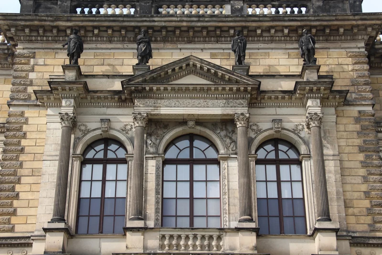The grand neoclassical Sempergalerie (Semper Gallery) wing of the Zwinger in Dresden, Germany, housing the Gemäldegalerie Alte Meister, with columns, pediments, arched windows and sculptures on the facade viewed from the square.