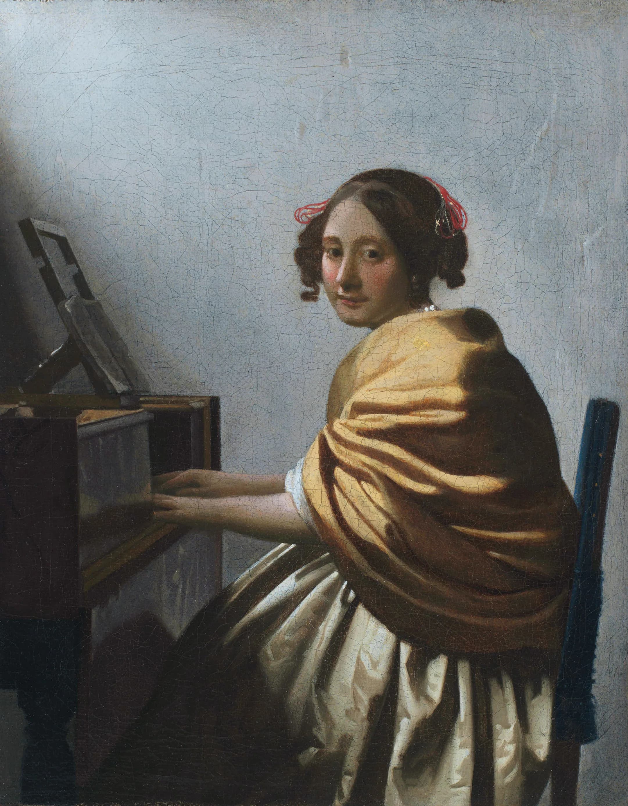 A Young Woman Seated at the Virginals attributed to Johannes Vermeer