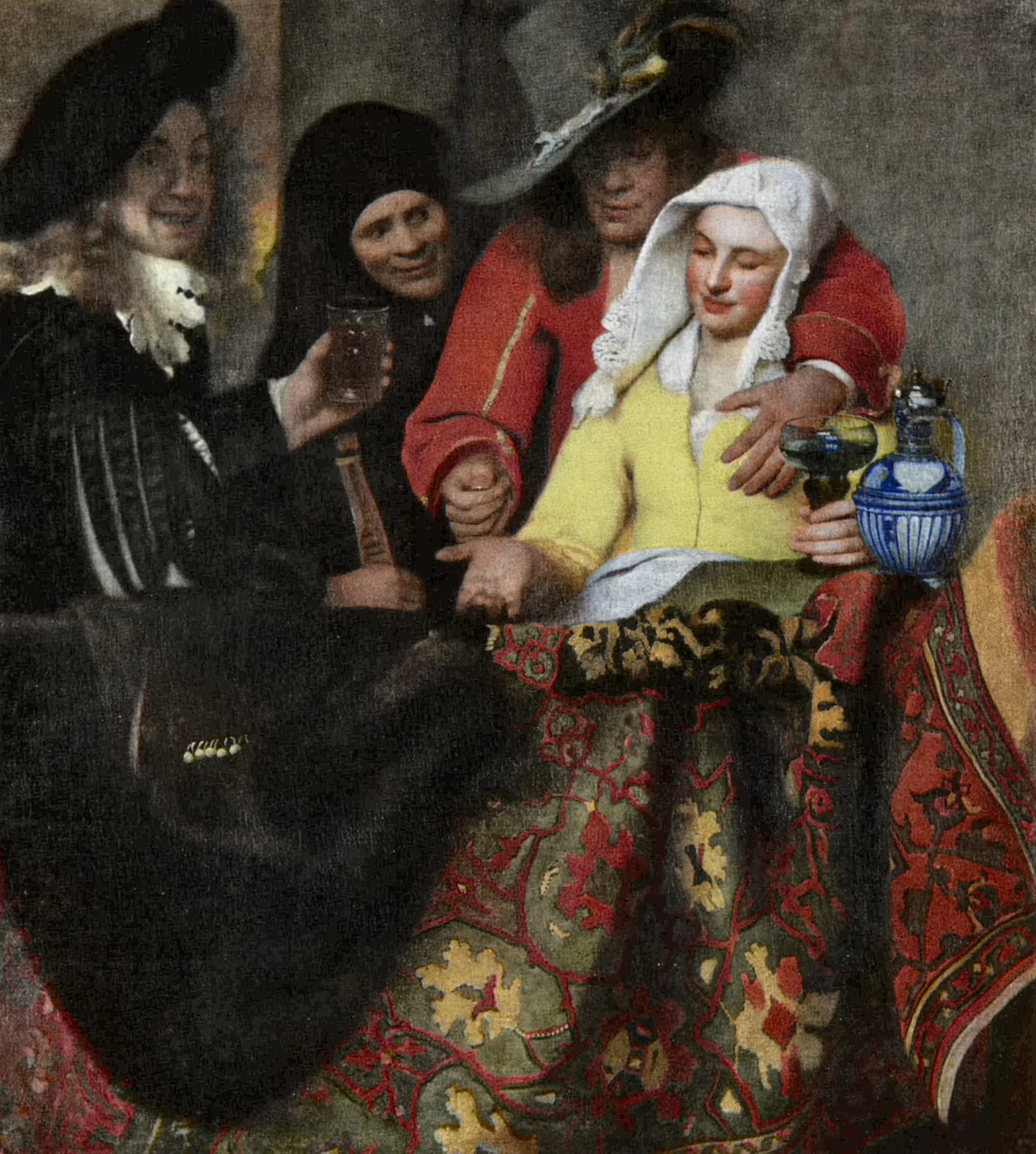 The Procuress by Johannes Vermeer after cleaning, the four figures gathered behind a carpet-draped table, the woman in a bright yellow jacket at the right