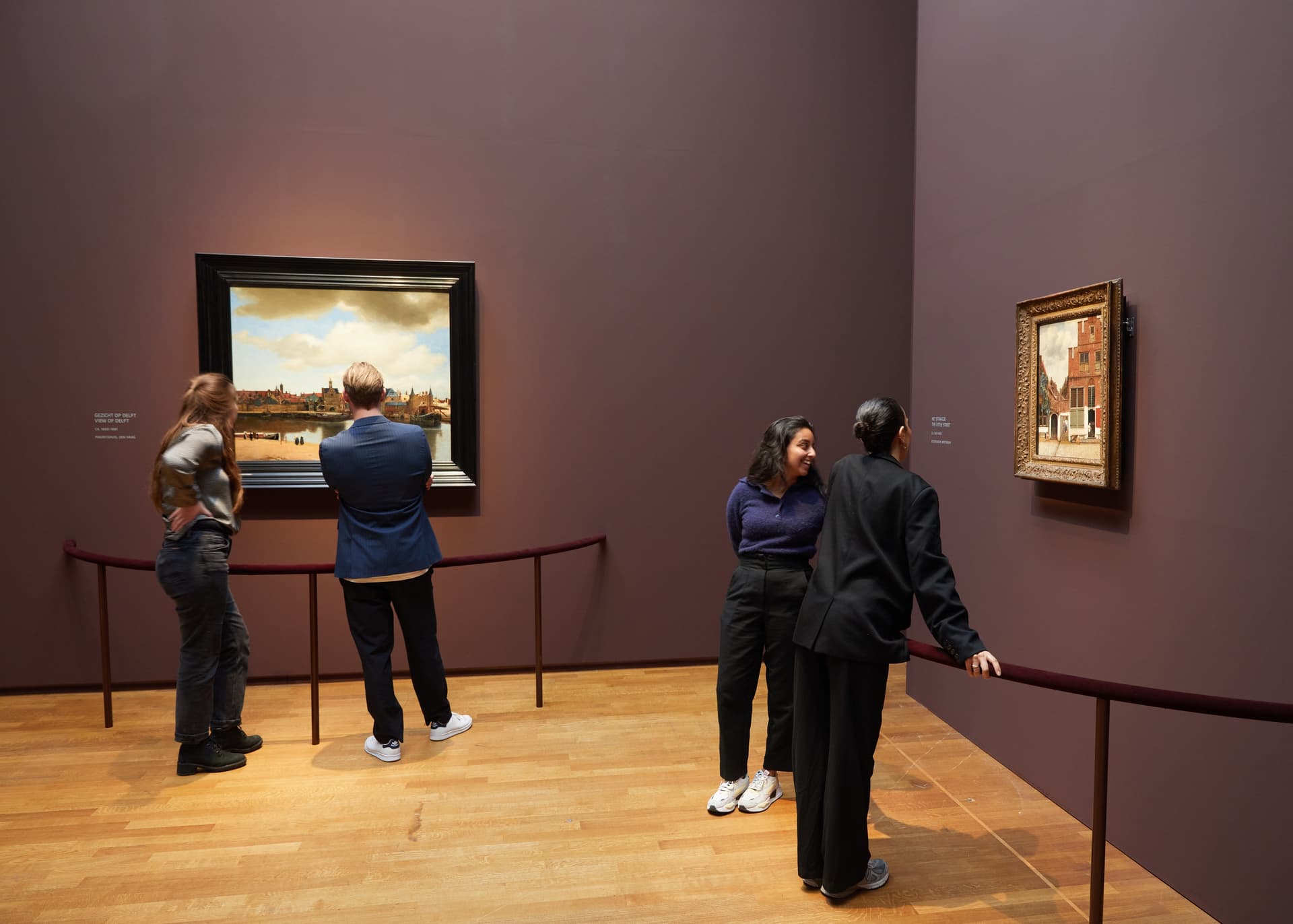 Visitors viewing View of Delft and The Little Street at the 2023 Vermeer retrospective at the Rijksmuseum. Credit: Rijksmuseum