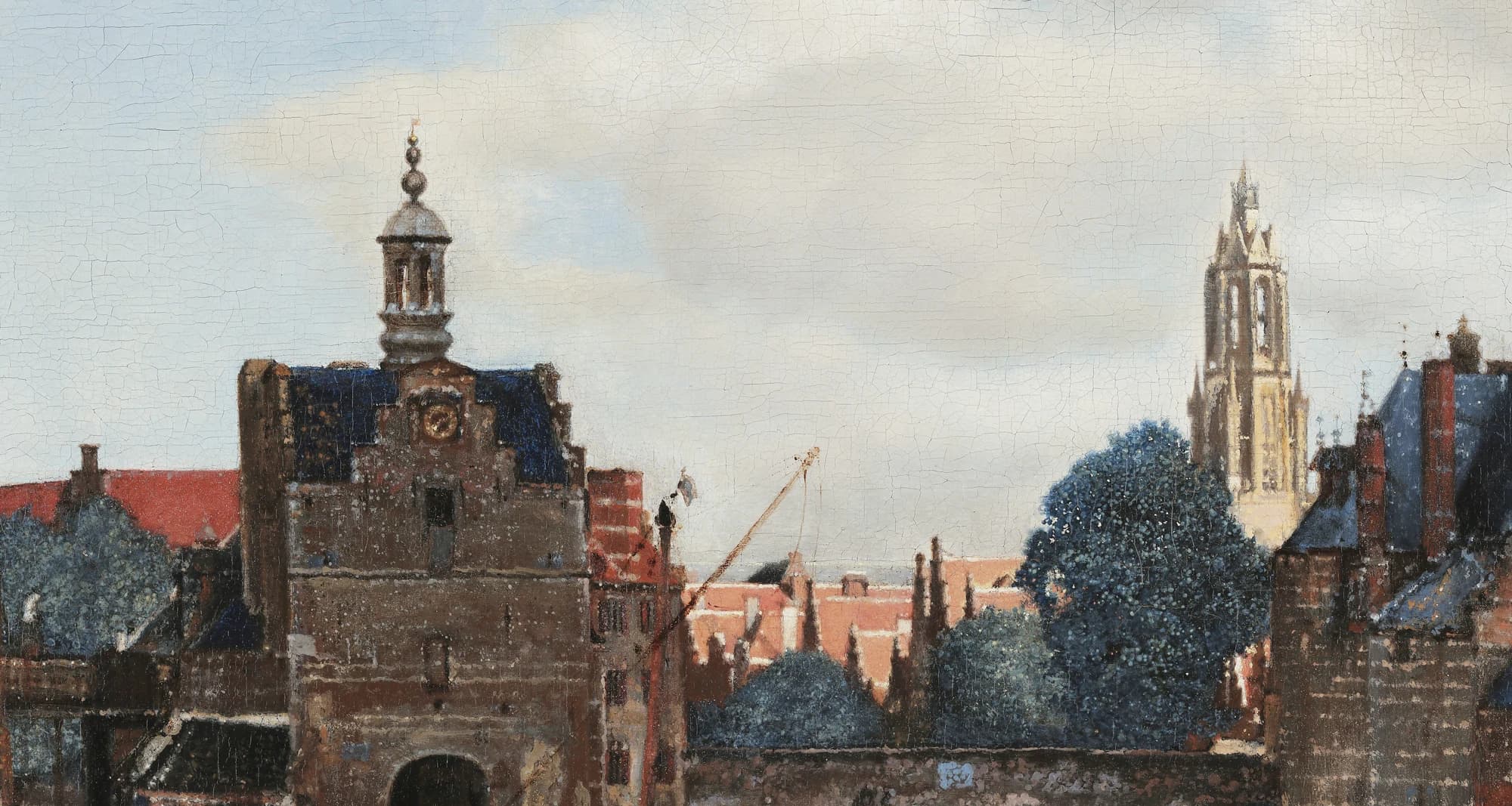 Detail of the sunlit far bank: the Schiedam Gate with its clock tower at left and the pale tower of the Nieuwe Kerk rising at right