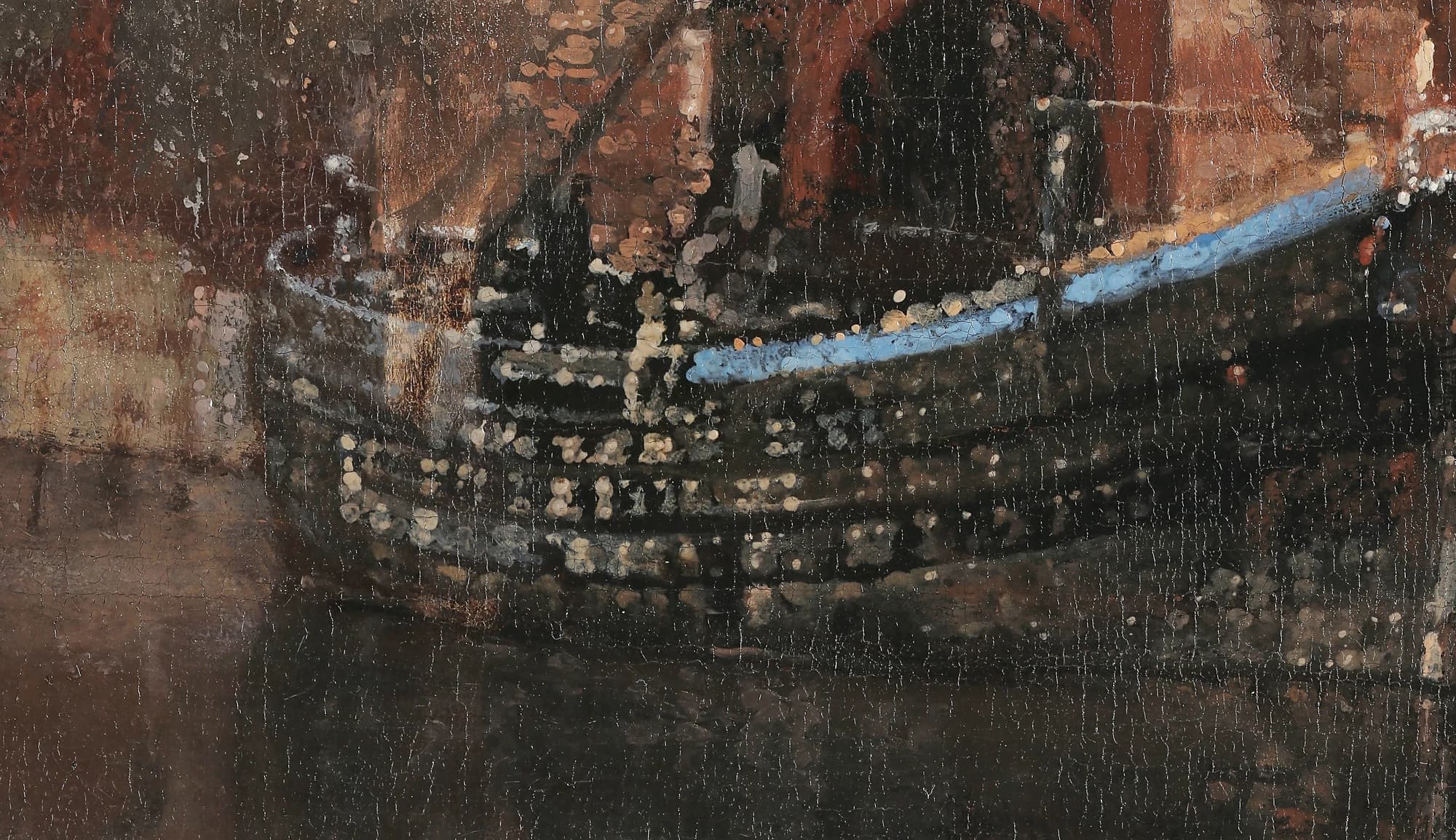 Detail of a dark herring boat moored against the quay, its hull and rigging studded with small soft dabs of bright paint