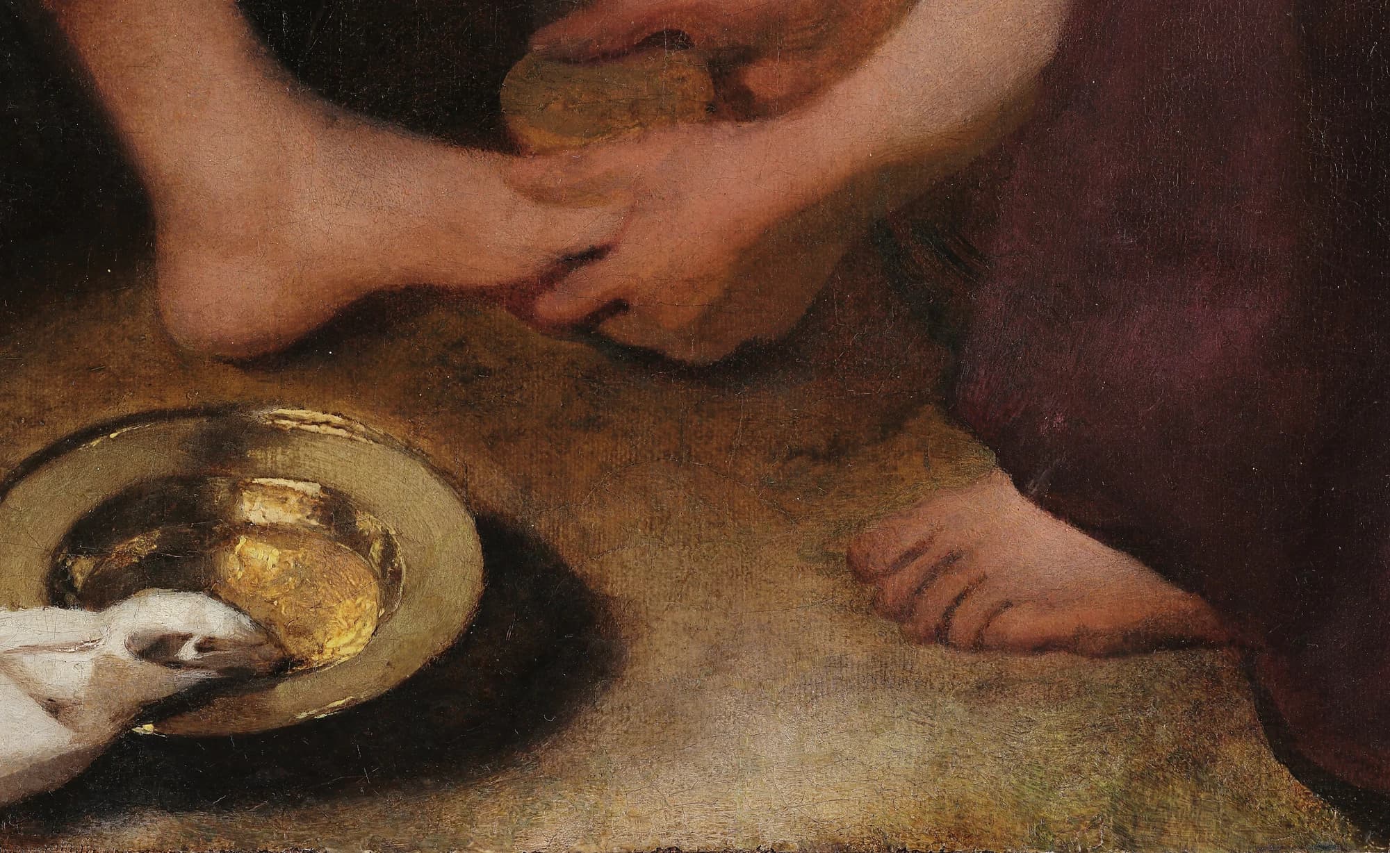 Detail of a nymph's hands cradling Diana's bare foot above a brass basin and a white cloth on the ground