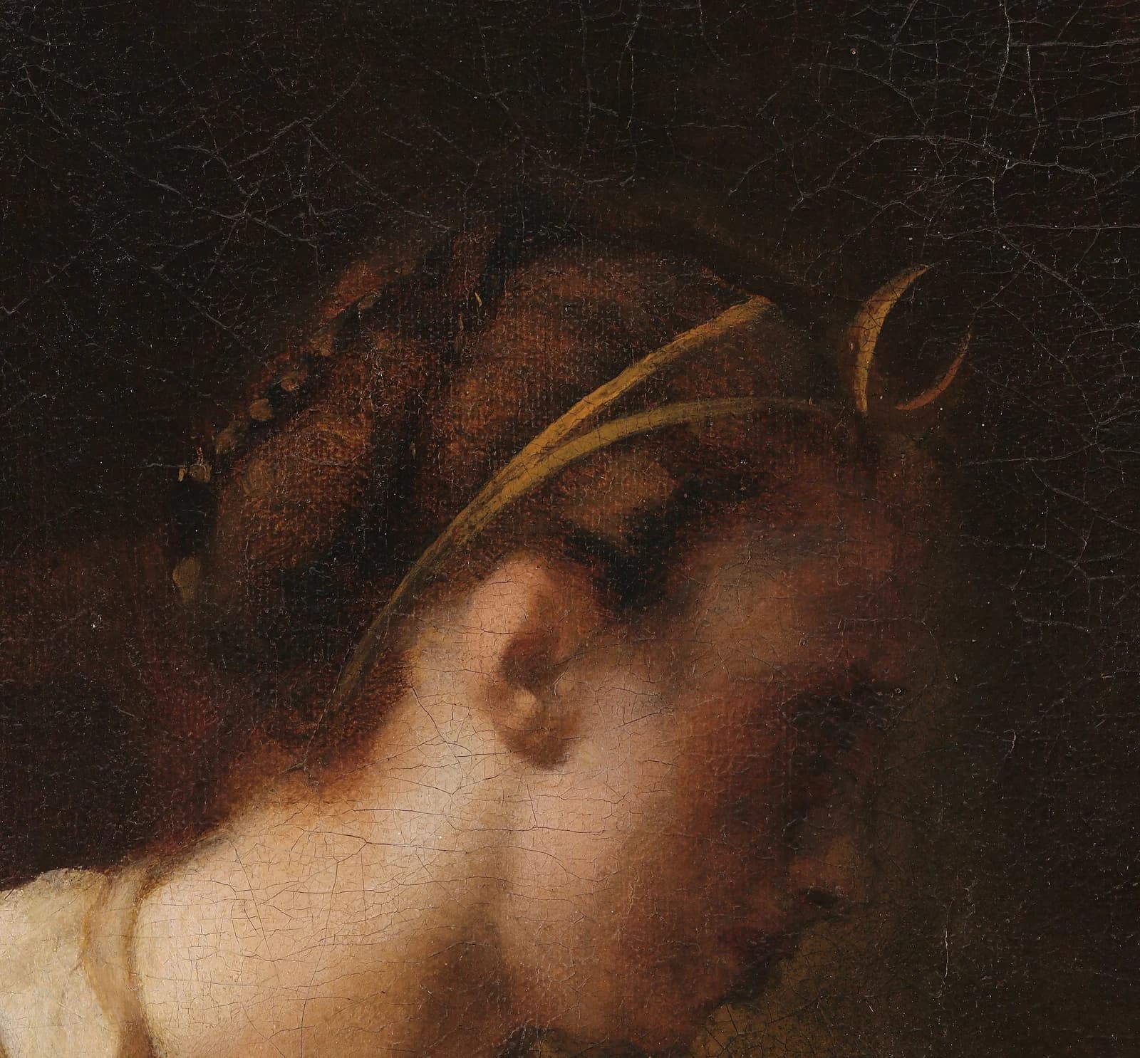 Detail of Diana's head in profile, a gold crescent moon held above her brow on a thin band, the rest of her attributes absent