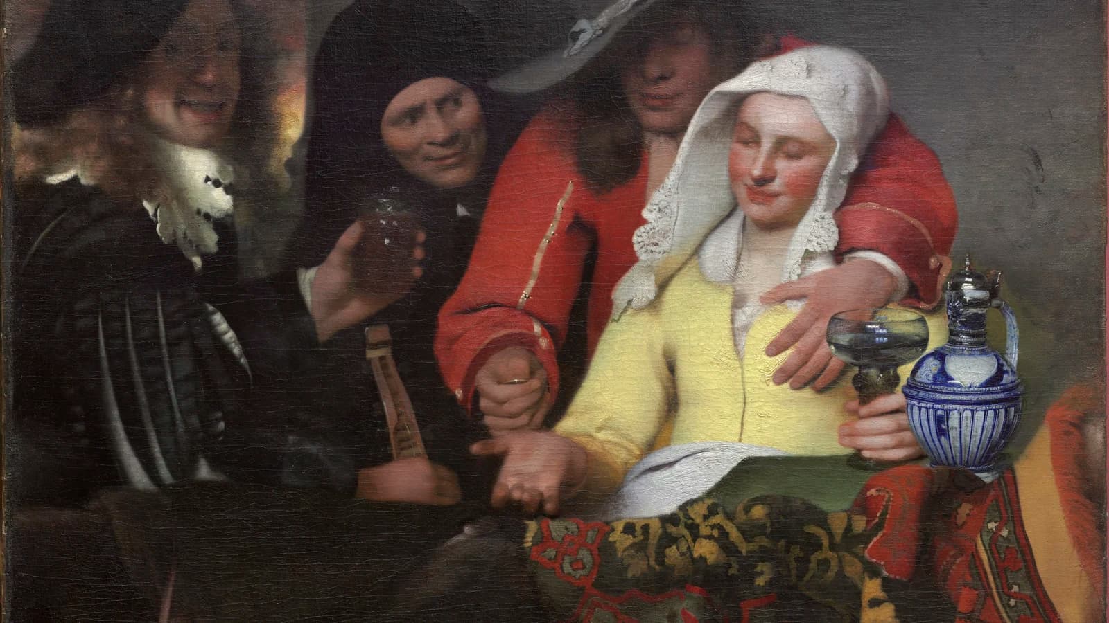 The four figures of Vermeer's The Procuress after cleaning: the grinning man with a cittern at the left, the procuress in black, the soldier in red, and the young woman in a bright yellow jacket beside a blue-and-white wine jug