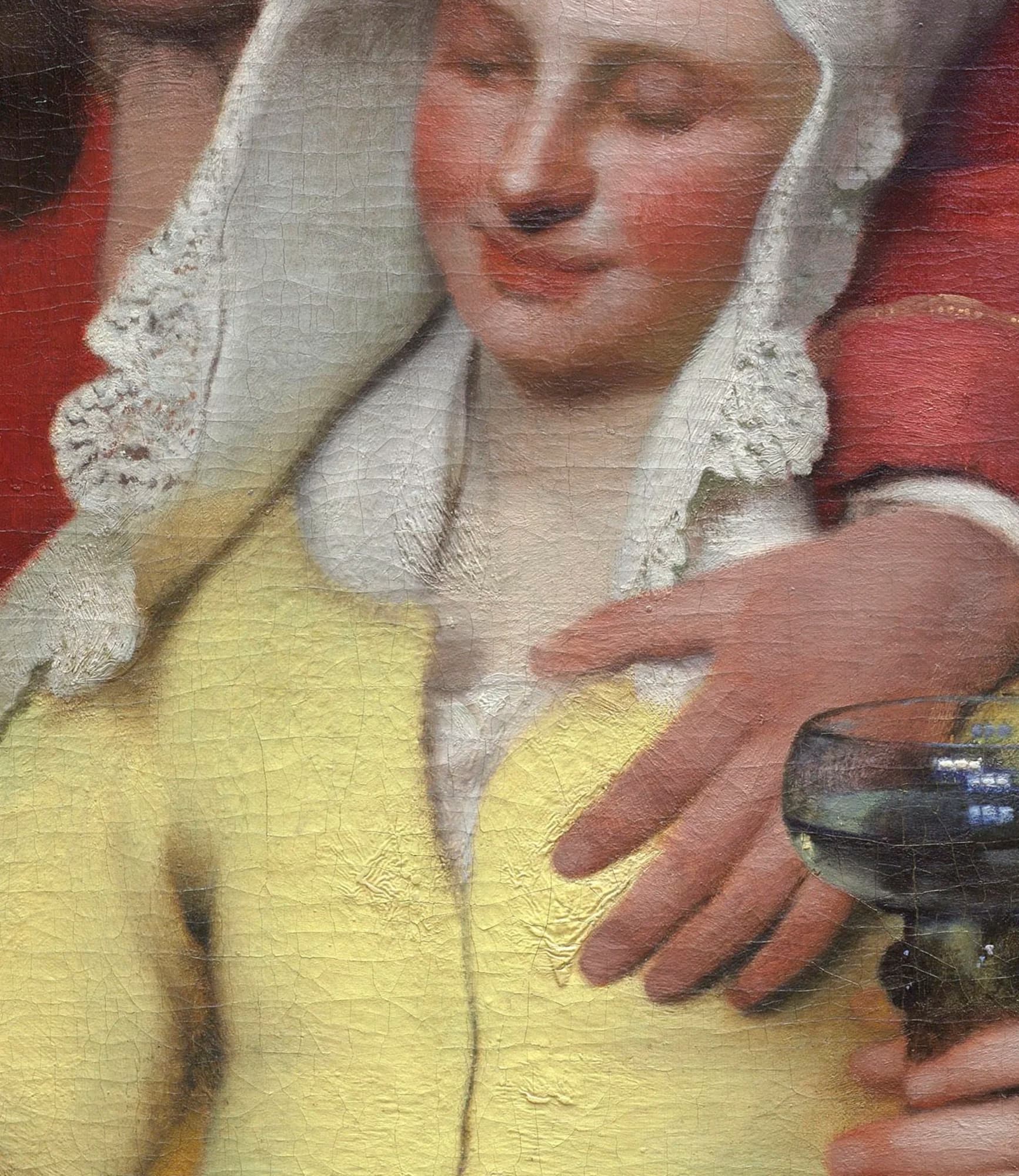 Detail of the young woman's jacket after cleaning, a bright lead-tin yellow with the soldier's hand resting on her and a wine glass at the right