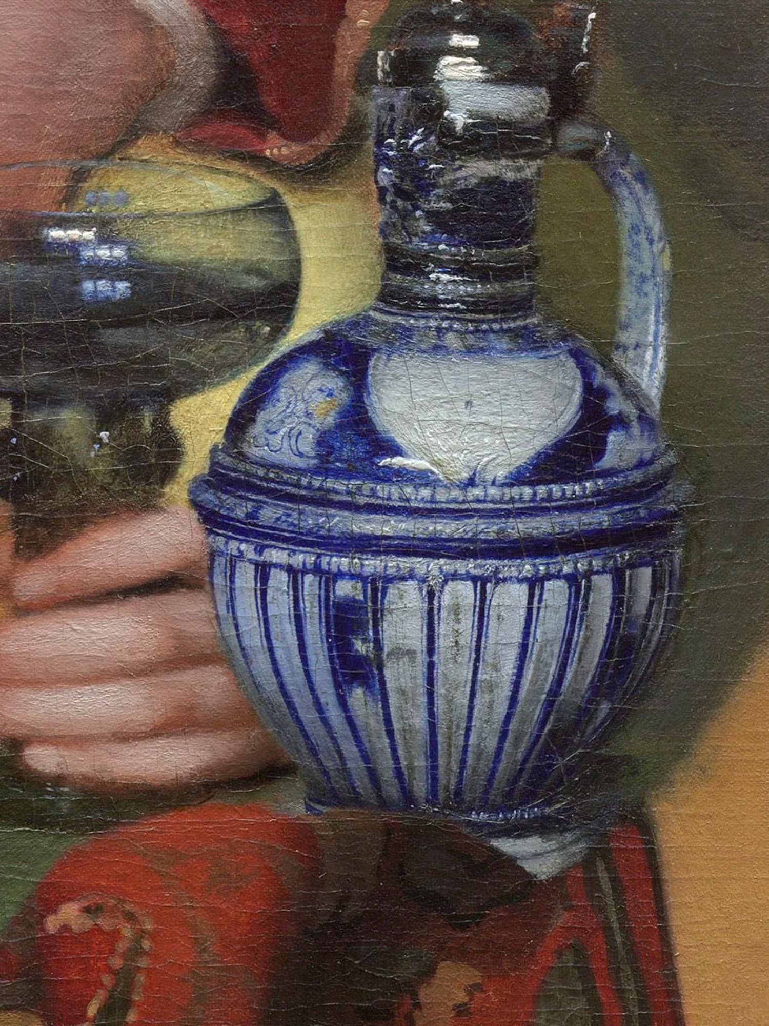 Detail of the blue-and-white wine jug after cleaning, its rounded body painted in ultramarine with a fluted lower half