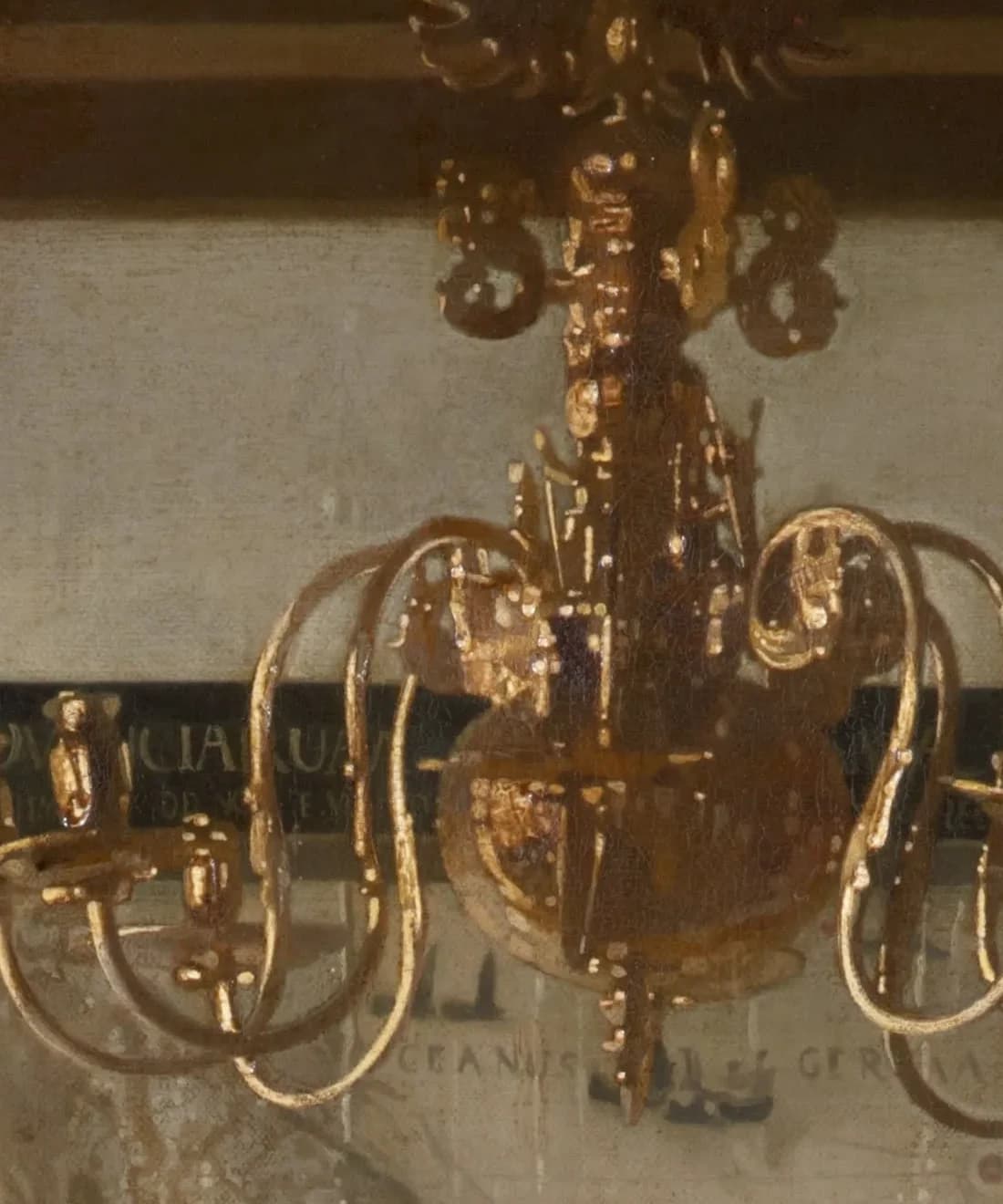 Detail of the gilt brass chandelier crowned by a double-headed eagle, its arms hanging in front of the map