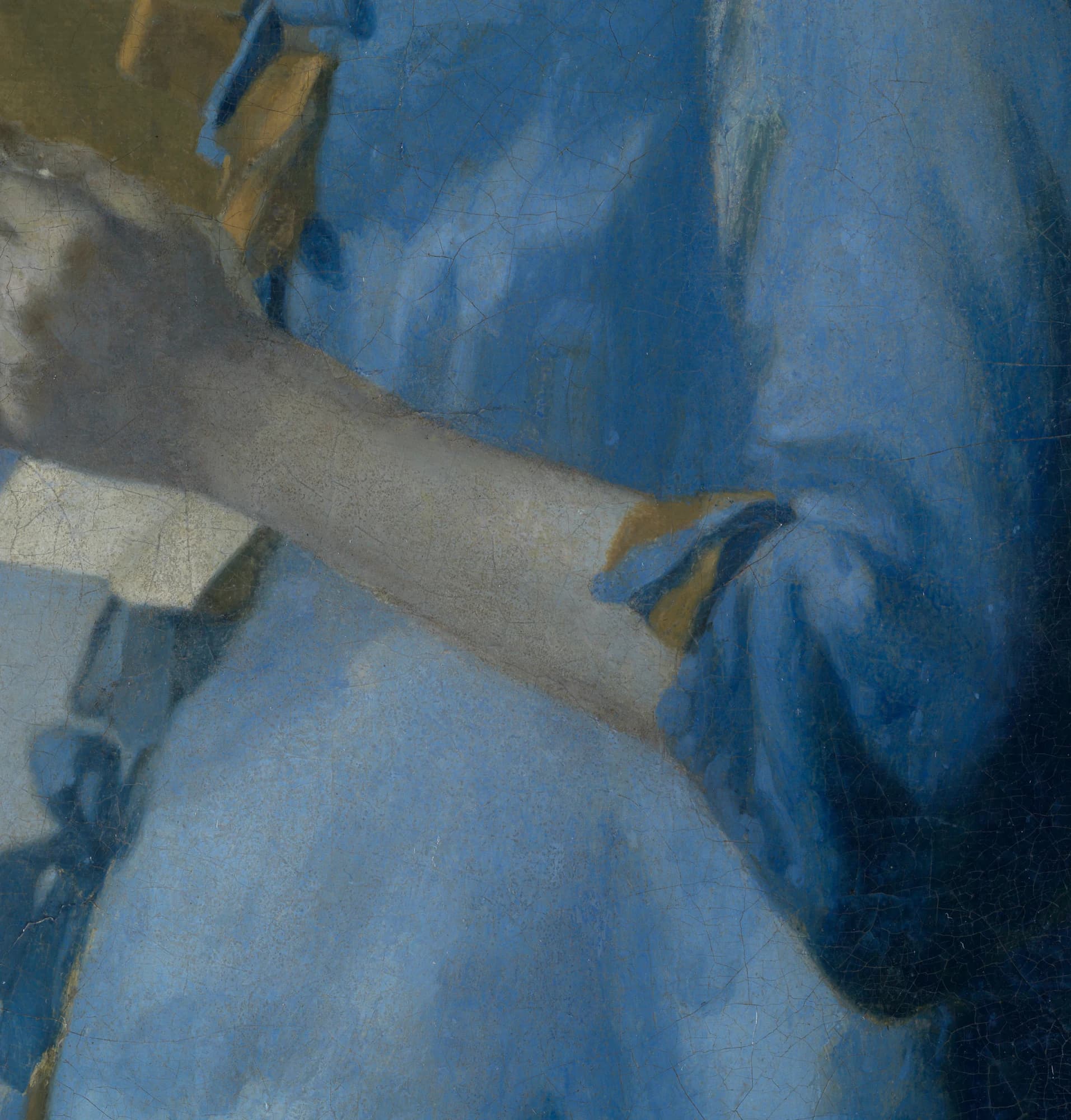 Detail of the woman's blue jacket and forearm after cleaning, the ultramarine vivid and the shadows still rendered in blue