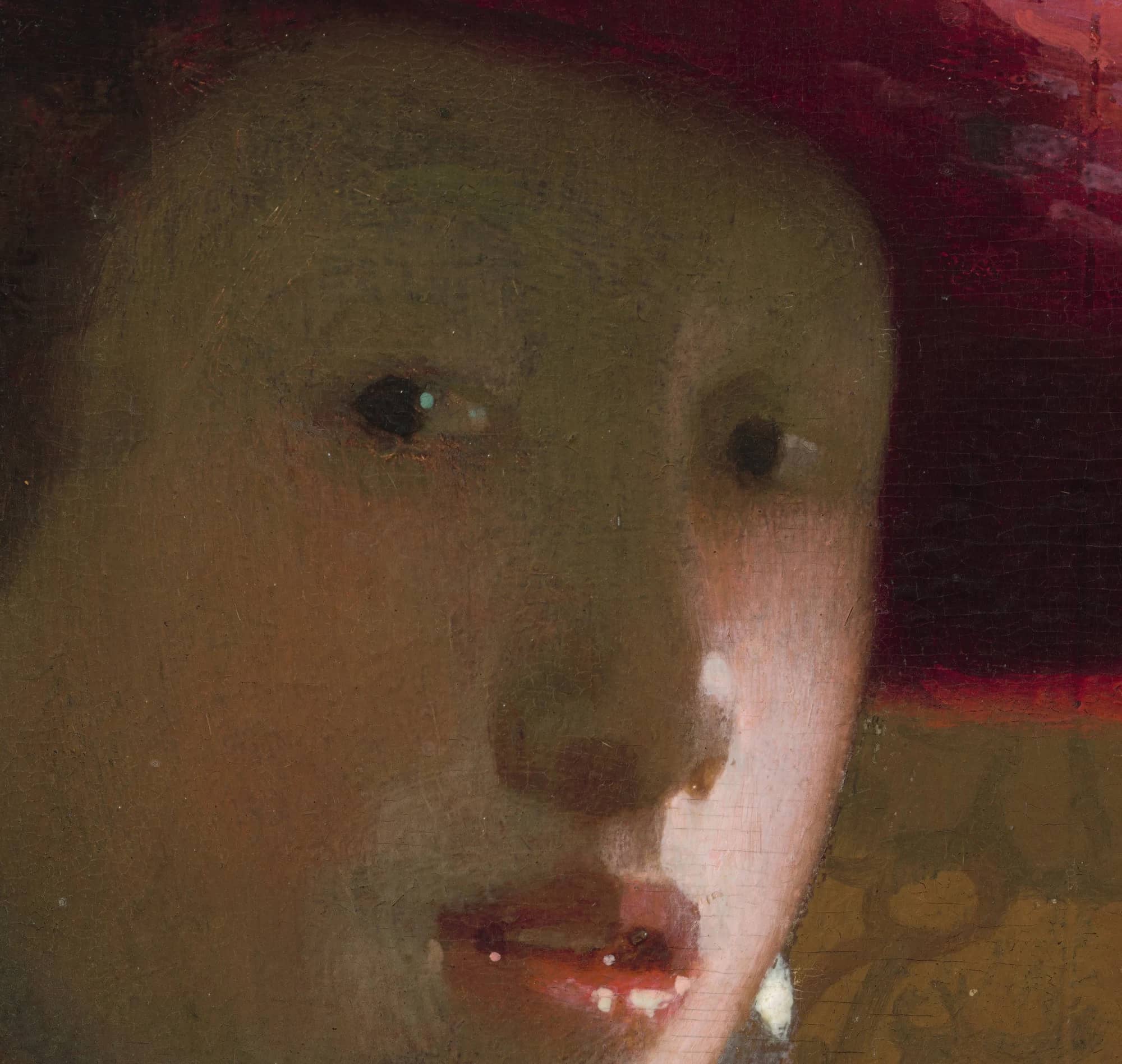 Detail of the face in Girl with a Red Hat, the greenish shadow feathered softly and a catchlight in the eye