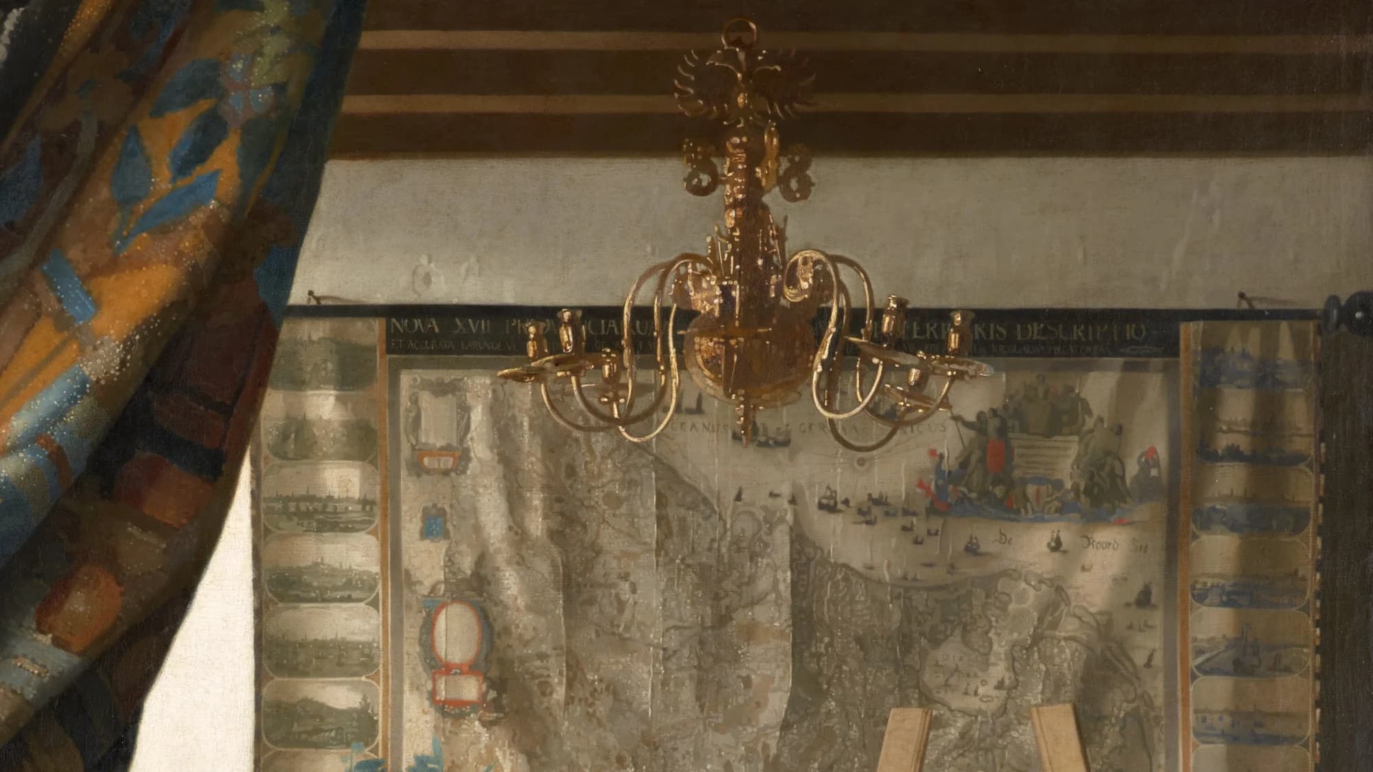 Detail of the large wall map of the Seventeen Provinces in Vermeer's The Art of Painting, with a brass chandelier hanging in front of it